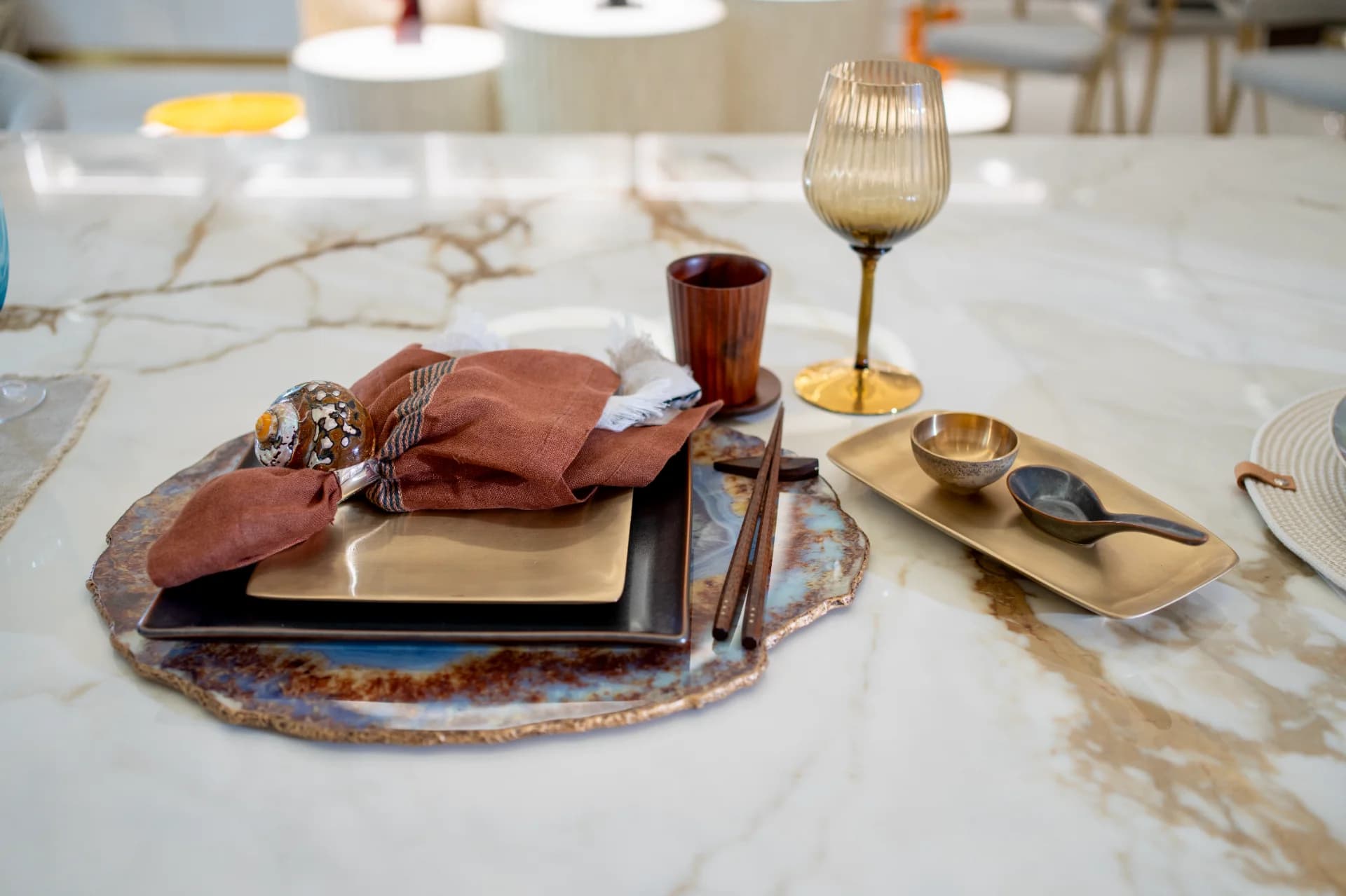 a luxury tablescape with neutral coloured tableware