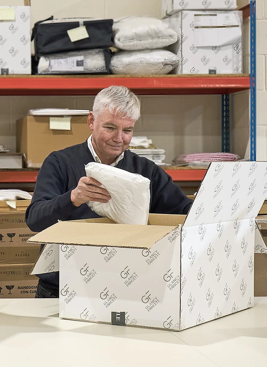 Glancy Fawcett Manchester logistics team member carefully inspecting a product