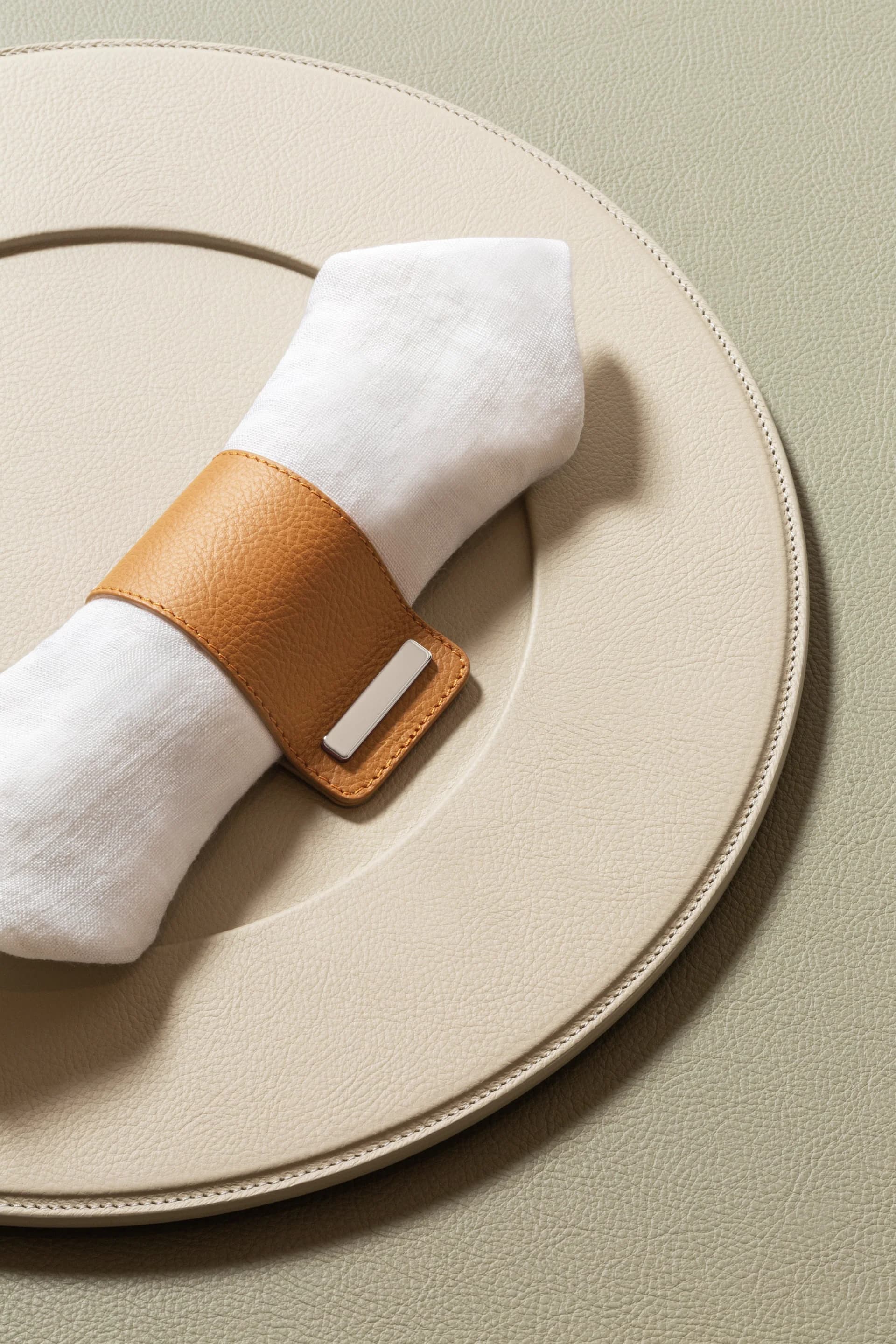 Luxurious table linens and napkins in a dining setting.