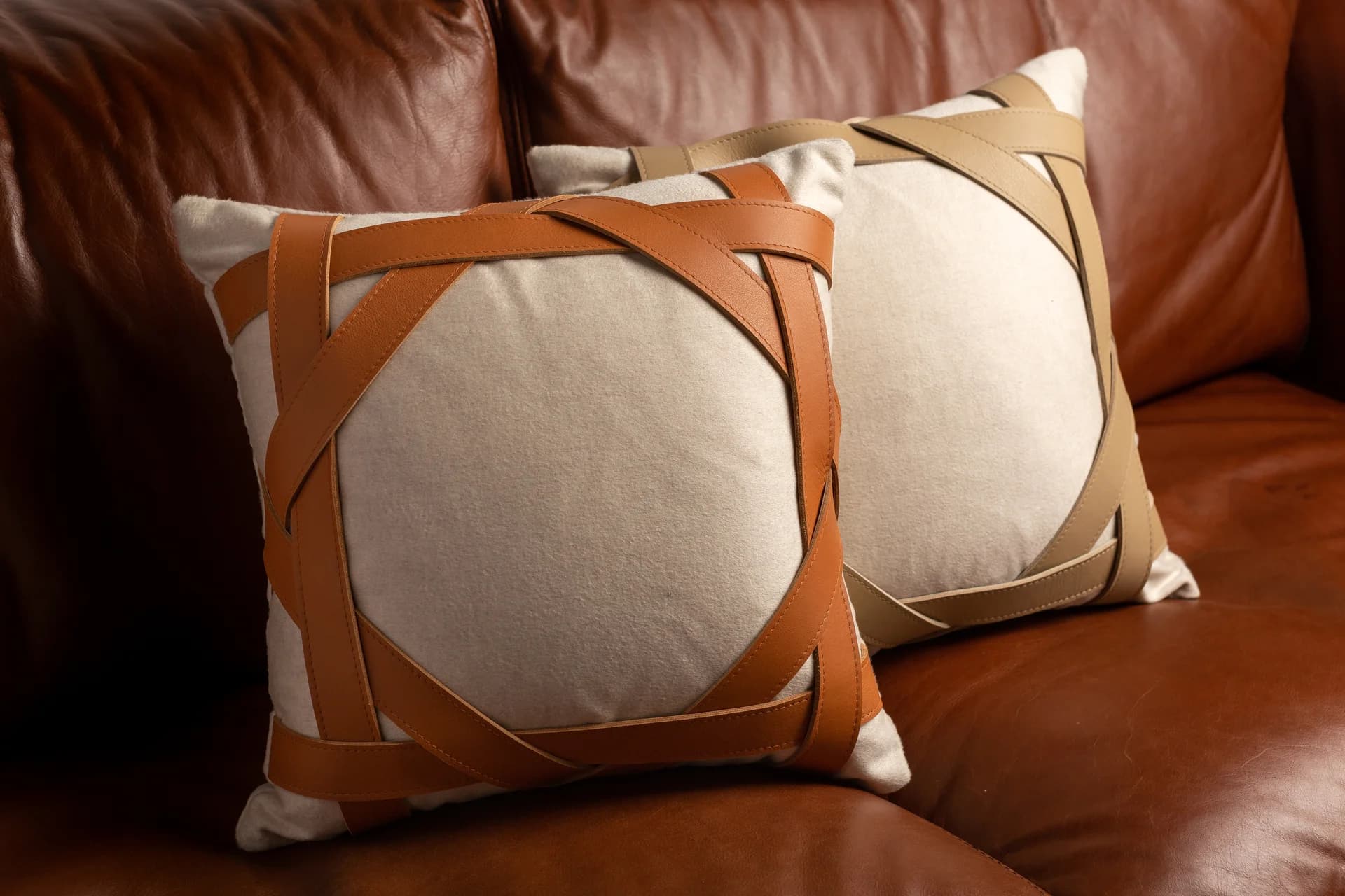 A collection of decorative cushions with various textures and patterns.