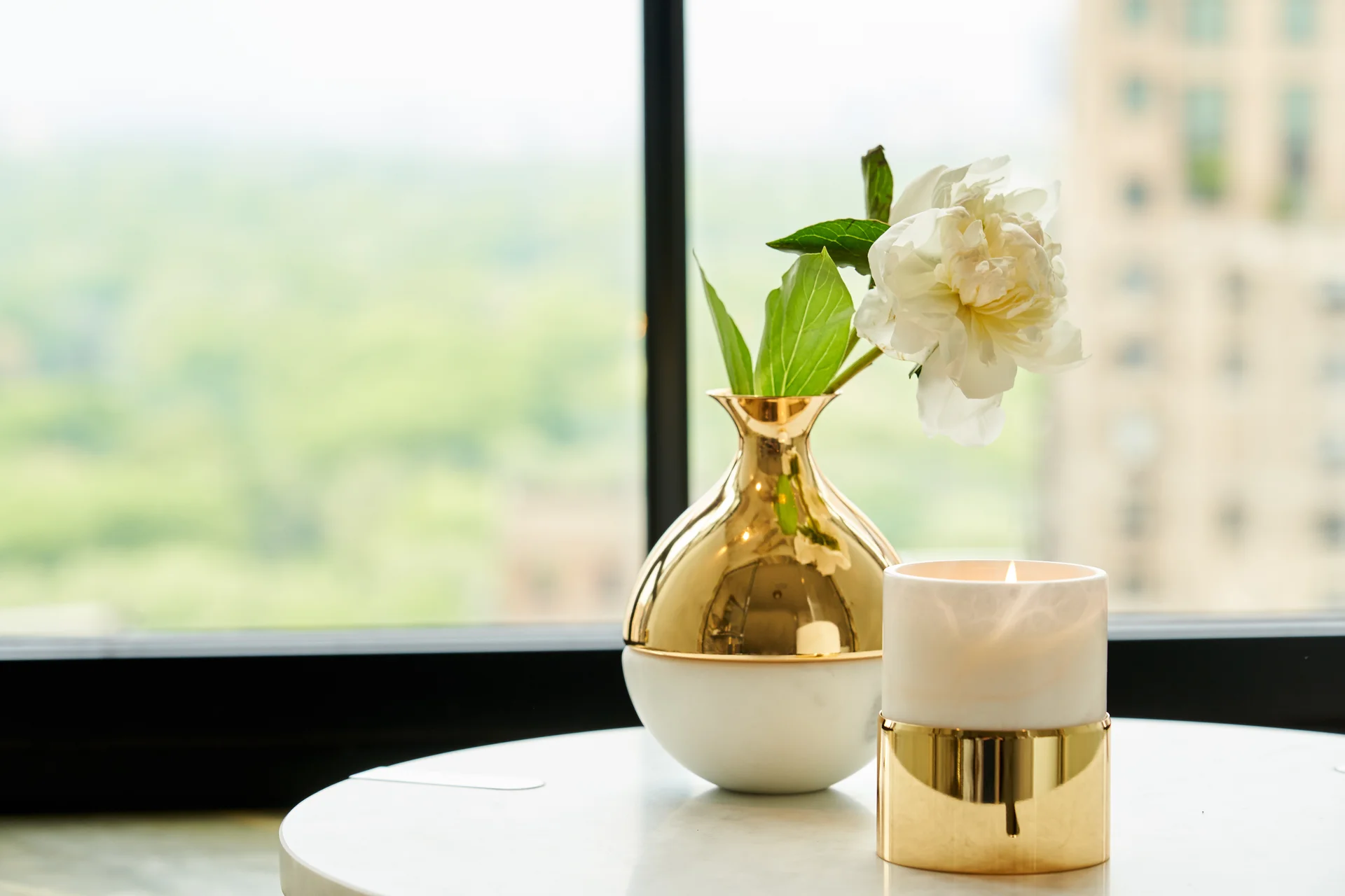 A stylish interior with decorative vases and sculptures.